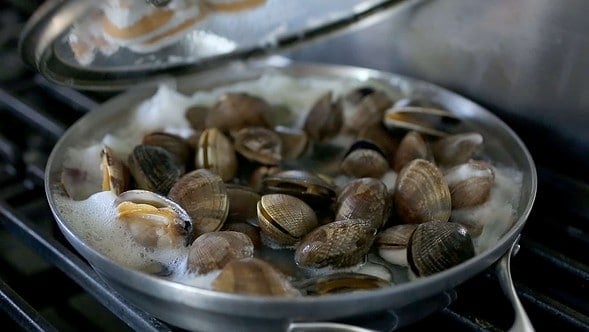 Clams boiling and opening