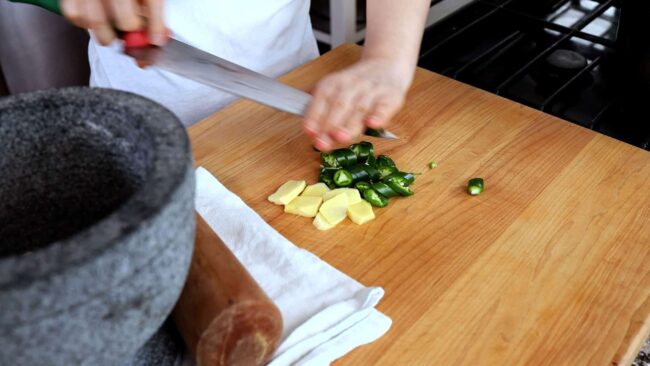 Chopping green chili pepper