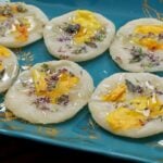 Korean pan-cooked rice cake with edible flowers