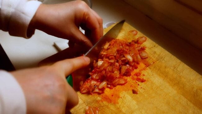 chopping kimchi