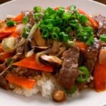 Beef and mushrooms stir-fried over rice (Soegogi-beoseot-deopbap: 쇠고기버섯덮밥)