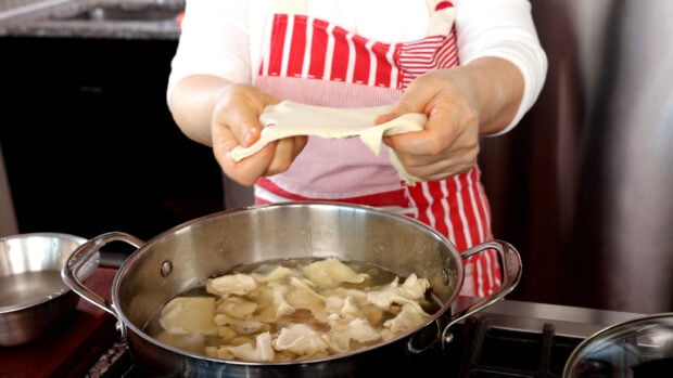 Making sujebi hand-torn noodles